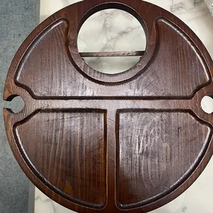 Detail view of portable wooden wine table with deep brown finish and grain texture
