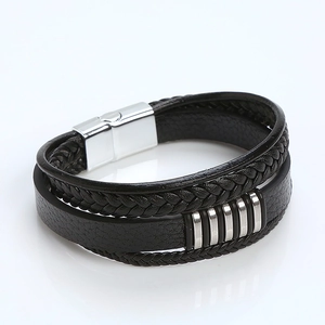 Detail of multi-layer braided leather bracelet with silver magnetic stainless steel clasp