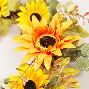 Autumn sunflower wreath with yellow and orange flowers and mixed greenery for home decor