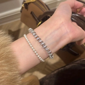 18K gold plated twisted bangle and pearl bracelet set with zircons for a layered look