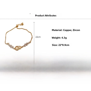 Detail view of gold gourd bracelet showing copper material, zircon inlay, and 22cm length