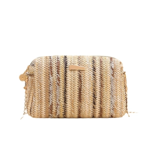 Rainbow striped straw woven camera bag with gold chain strap for women on white background