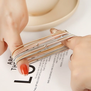 Classic layered gold and silver stretch spring bracelets with mini smooth beads for women