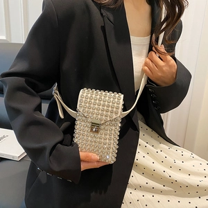 Fashionable white rhinestone crossbody bag with metallic clasp and adjustable strap
