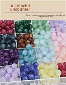 Close-up of colorful 10mm frosted glass beads organized in a divided acrylic storage box