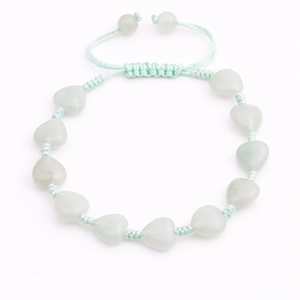 Detail of adjustable woven cord bracelet featuring heart-shaped light green crystal beads