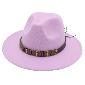 Detail of bohemian leather hat band with metal shell charms on lilac wool fedora hat