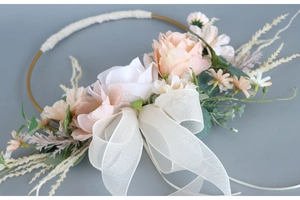 Detail of bridal floral hoop with silk peonies, daisies and flowing organza ribbon