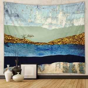 Detail of a modern abstract tapestry featuring teal mountains and golden textures