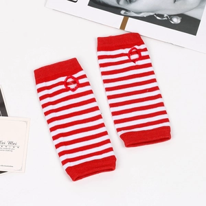 Detailed knit texture of red and white striped fingerless arm warmers on white background