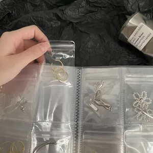 Transparent PVC jewelry organizer book with thick PE seal bags for necklaces and rings
