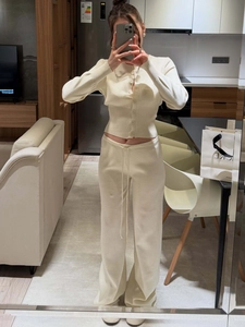 Women's cream knit set featuring a slim-fit button cardigan and drawstring wide-leg pants
