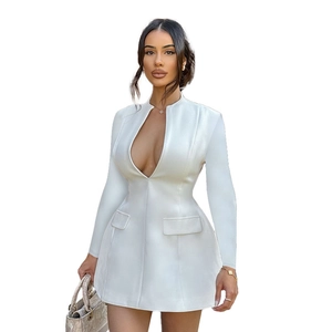 Detail shot of the white deep V-neck long sleeve dress with sharp suit-style tailoring