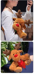Close-up of reindeer plush toy with red snowflake scarf and soft brown fur textures