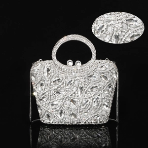 Close-up of sparkling rhinestone evening bag with luxury crystal bow and metal handles