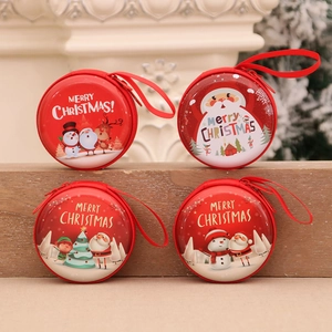 Set of 4 red Christmas coin purses with Santa and reindeer motifs in a festive setting