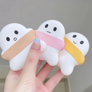 Three cloud-shaped marshmallow makeup puffs in white with pastel ribbons for flawless blending
