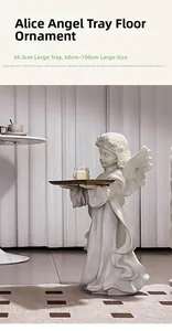Detail view of vintage white angel statue with golden tray holding a candle ornament