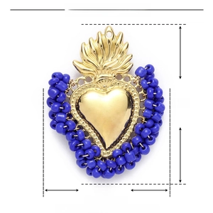 Detailed view of Sacred Heart pendant with blue resin beads and dimension markings