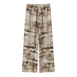 Detailed view of high-waisted wide leg pants with abstract marble tie-dye pattern