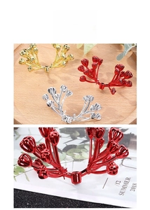 Macro detail of red, gold and silver Christmas berry stems for festive wreath DIY decor