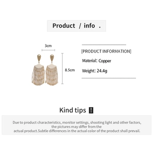 Detailed view of gold fan-shaped tassel earrings showing 8.5cm length and copper material