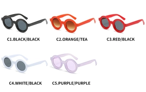 Flat lay of minimalist round sunglasses in five vibrant colors with sleek plastic frames