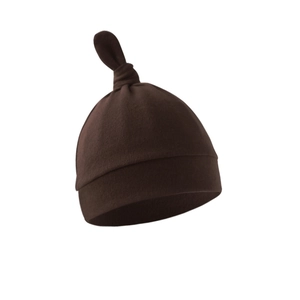 Detail shot of a soft dark brown newborn knit cotton cap with a top knot design