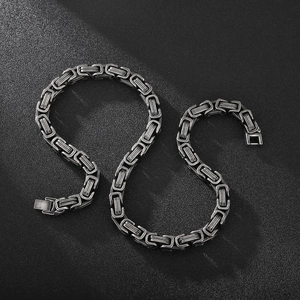 Detail of vintage Byzantine style stainless steel chain necklace with fold-over clasp