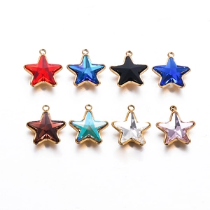 Macro shot of colorful glass star pendants in gold plated stainless steel frames