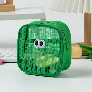 Detail of green mesh makeup bag with cute embroidered eyes and transparent storage view