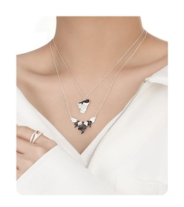 Detail of S925 silver irregular leaf necklace and matching textured ring set for women