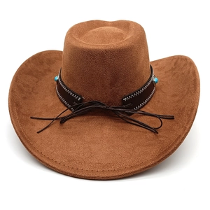 Detail of western brown felt cowboy hat with leather band and turquoise bead accents