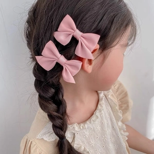 Set of two light pink bow hair clips for girls made of premium ribbed grosgrain ribbon