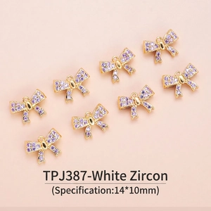 Detail of 14x10mm 18K gold plated bow pendants with inlaid purple cubic zirconia
