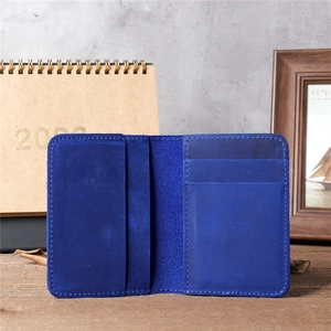 Macro detail of royal blue genuine leather card holder with multiple card slots