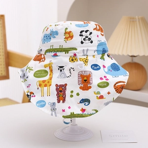 Detail of kids sun hat with cartoon animal prints and adjustable neck protection strap