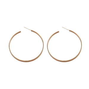 Minimalist polished golden flat hoop earrings in a classic circular design for women
