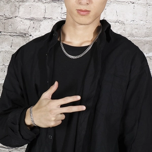 8mm silver titanium steel Cuban link chain necklace and bracelet set worn by a male model