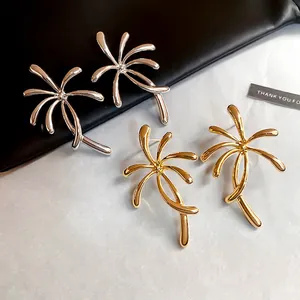 Artistic palm tree leaf metal stud earrings in gold and silver finish for women