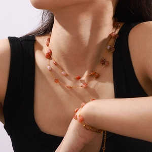 Elegant gold double-layer necklace and bracelet set with natural pink agate beads