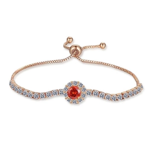 Champagne gold bracelet with a red gemstone sunflower charm and adjustable drawstring