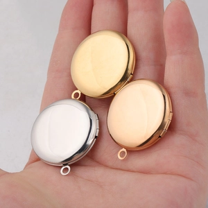 Detailed view of three circular 316L stainless steel photo lockets in gold, silver and rose gold