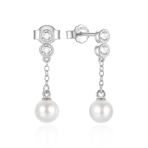 Close-up of S925 sterling silver stamp on earrings with zircons and white pearls