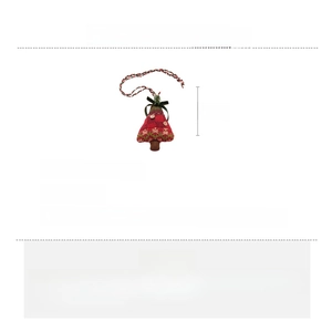 Macro shot of knitted Christmas tree pendant necklace with red and green wool texture