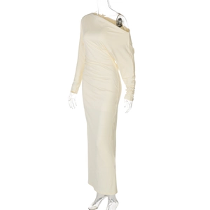 Close-up of cream-colored off-shoulder long-sleeved dress with elegant side-draped details