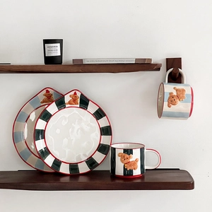 Ceramic mug and plate set featuring 3D party dog motifs and vibrant striped patterns