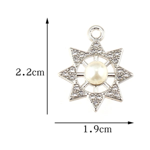 Octagonal star pendant with rhinestones and pearl centerpiece, measuring 2.2cm x 1.9cm