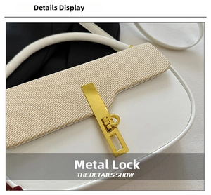 Close-up of golden metal twist lock and woven texture detail on the leather handbag