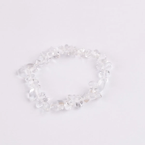 Close-up of clear natural crystal quartz chip beads on an elastic stretch bracelet
